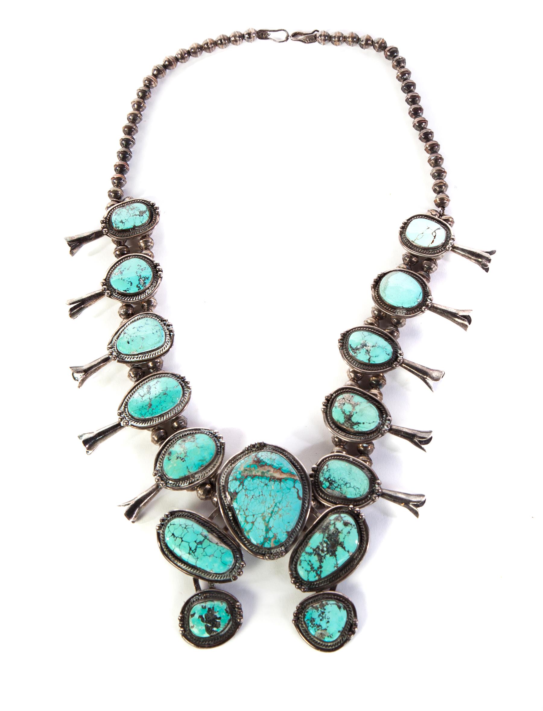 Appraisal: SILVER AND TURQUOISE SQUASH BLOSSOM NECKLACE American th century Silver