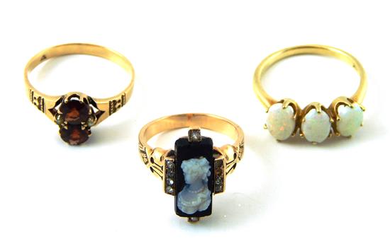 Appraisal: JEWELRY Three K yellow gold rings all with varied stones