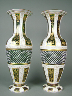 Appraisal: Pair of Bohemian green glass and white overlaid baluster shaped