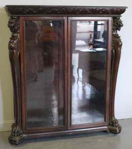 Appraisal: Mahogany Door Bookcase with Claw Feet Griffin Carving Possibly Horner