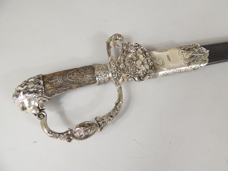 Appraisal: A German hunting type short sword with simulated ivory handle