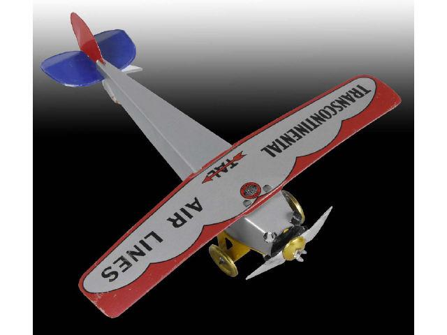 Appraisal: Girard Transcontinental Airplane with Original Box Description Tin push toy