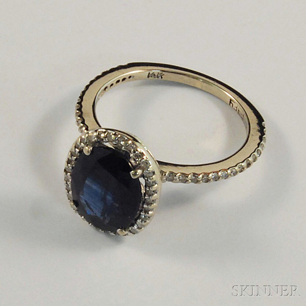 Appraisal: kt White Gold Sapphire and Diamond Ring the oval-cut sapphire