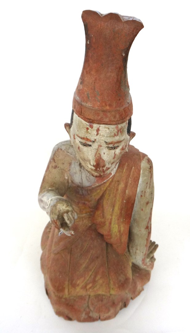 Appraisal: A South East Asian polychrome decorated carved wood figure depicting