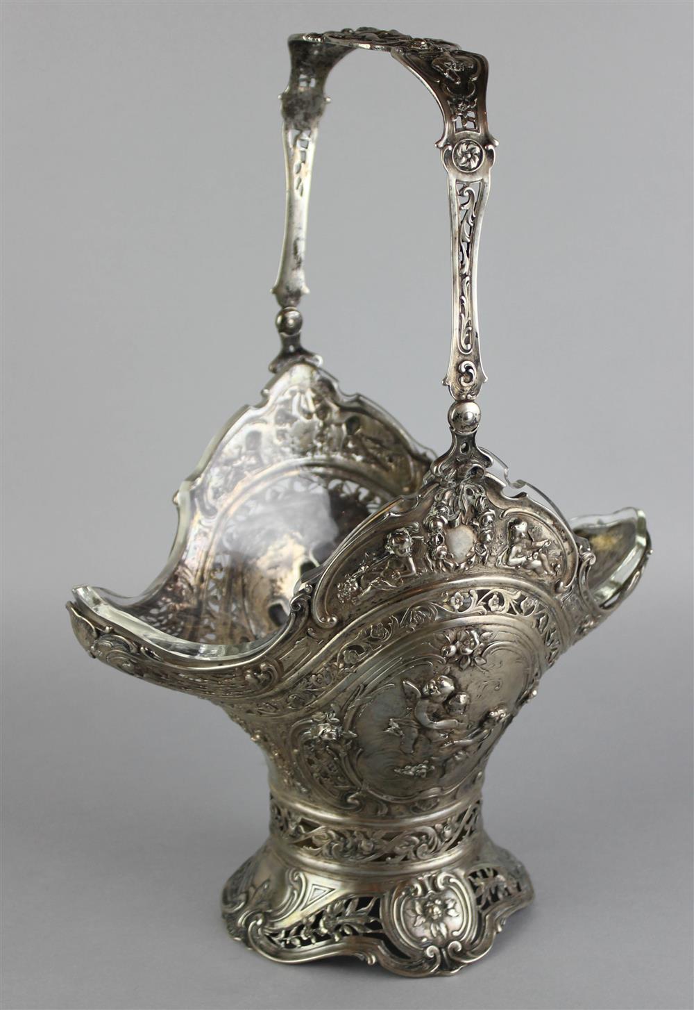 Appraisal: GERMAN SILVER AND GLASS SWING-HANDLED BRIDAL BASKET and unidentified marks