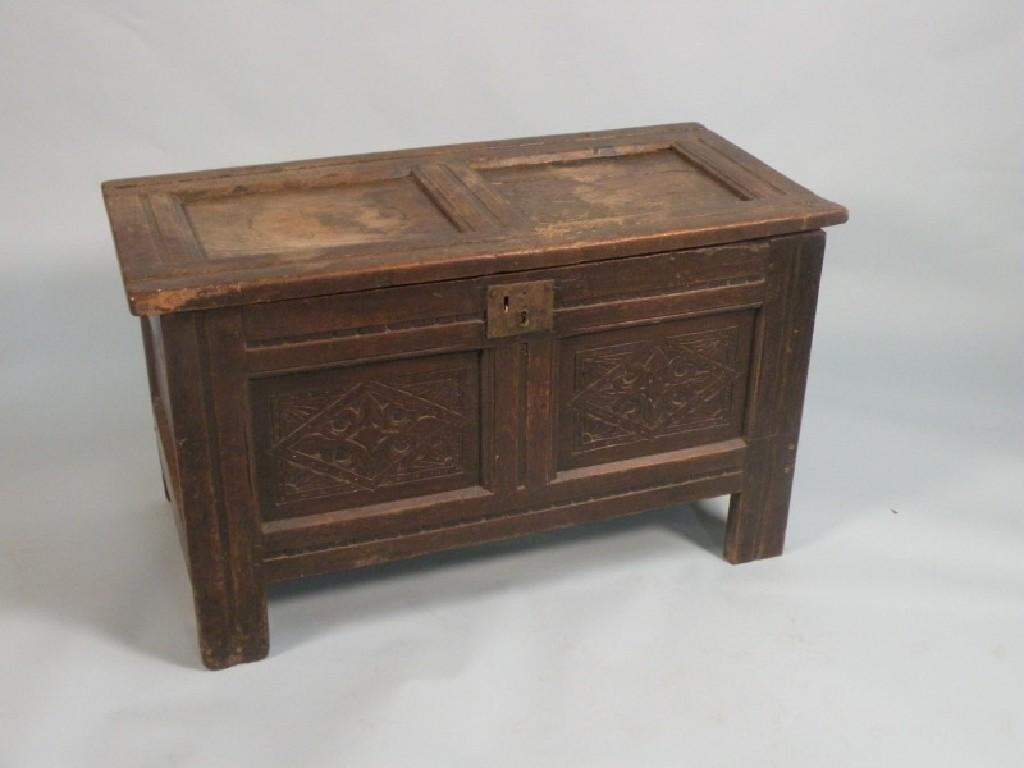 Appraisal: A thC panelled oak coffer with a hinged lid the