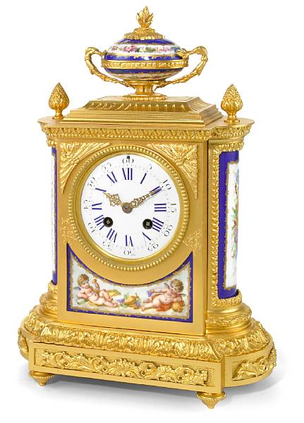 Appraisal: A Louis XVI style porcelain mounted gilt bronze mantel clock