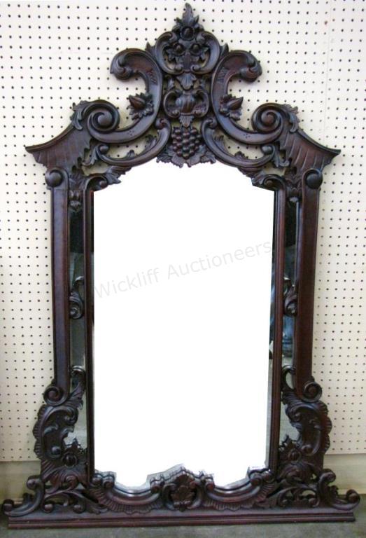 Appraisal: A carved mahogany Indonesian wall mirror French style carving x