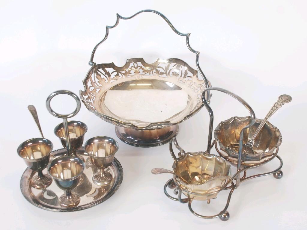 Appraisal: ELECTROPLATED CIRCULAR SWING HANDLED CAKE BASKET with shaped and cut