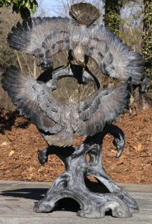 Appraisal: Bronze sculpture of two eagles in flight h Patinated bronze