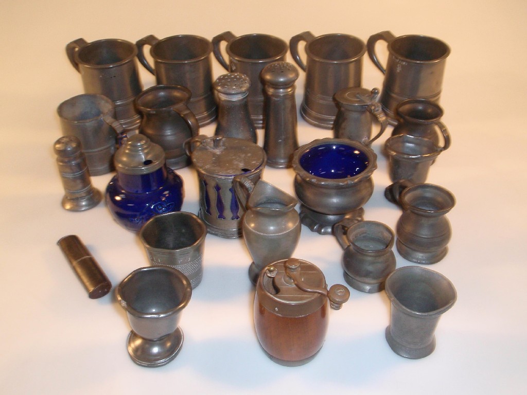 Appraisal: A quantity of pewter measures two muffineers mustards pepper grinder