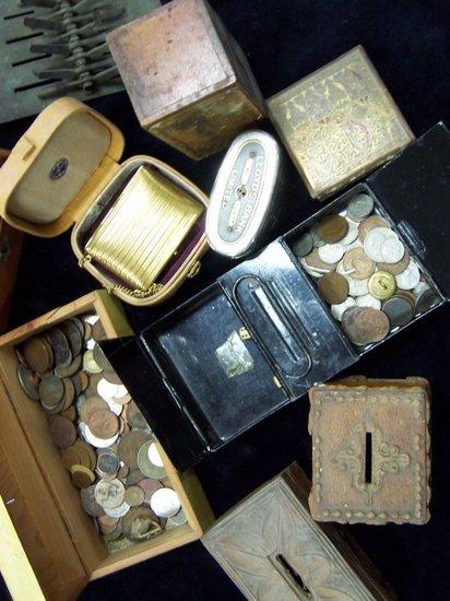 Appraisal: A small collection of money boxes and sundry coins