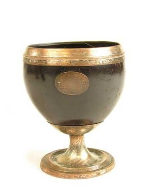 Appraisal: An early th century coconut stem goblet with plated on