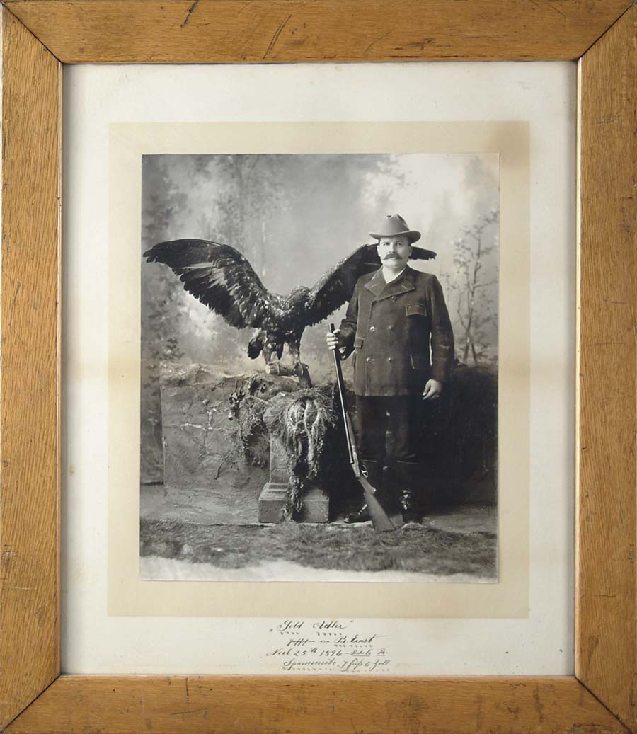 Appraisal: FRAMED PHOTO OF MAN STANDING WITH SHOTGUN AND EAGLE Title