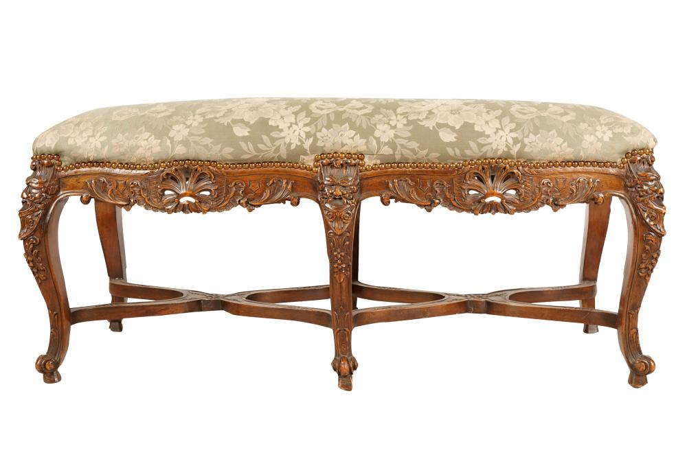 Appraisal: FRENCH WALNUT UPHOLSTERED BENCHhaving six cabriole legs with grotesque decoration