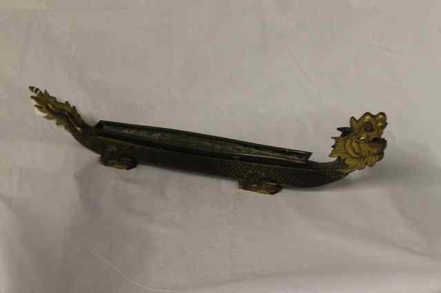 Appraisal: A TIBETAN CARVED WOOD DRAGON BOAT CLOCK with gilded and