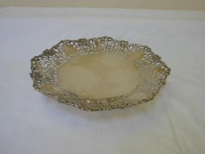 Appraisal: A CAKE STAND of octagonal form the pierced scrolling foliate