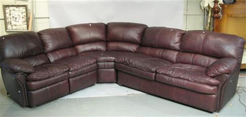 Appraisal: RAF SLEEPER TUSCANY LEATHER SECTIONAL SOFA th century the overstuffed