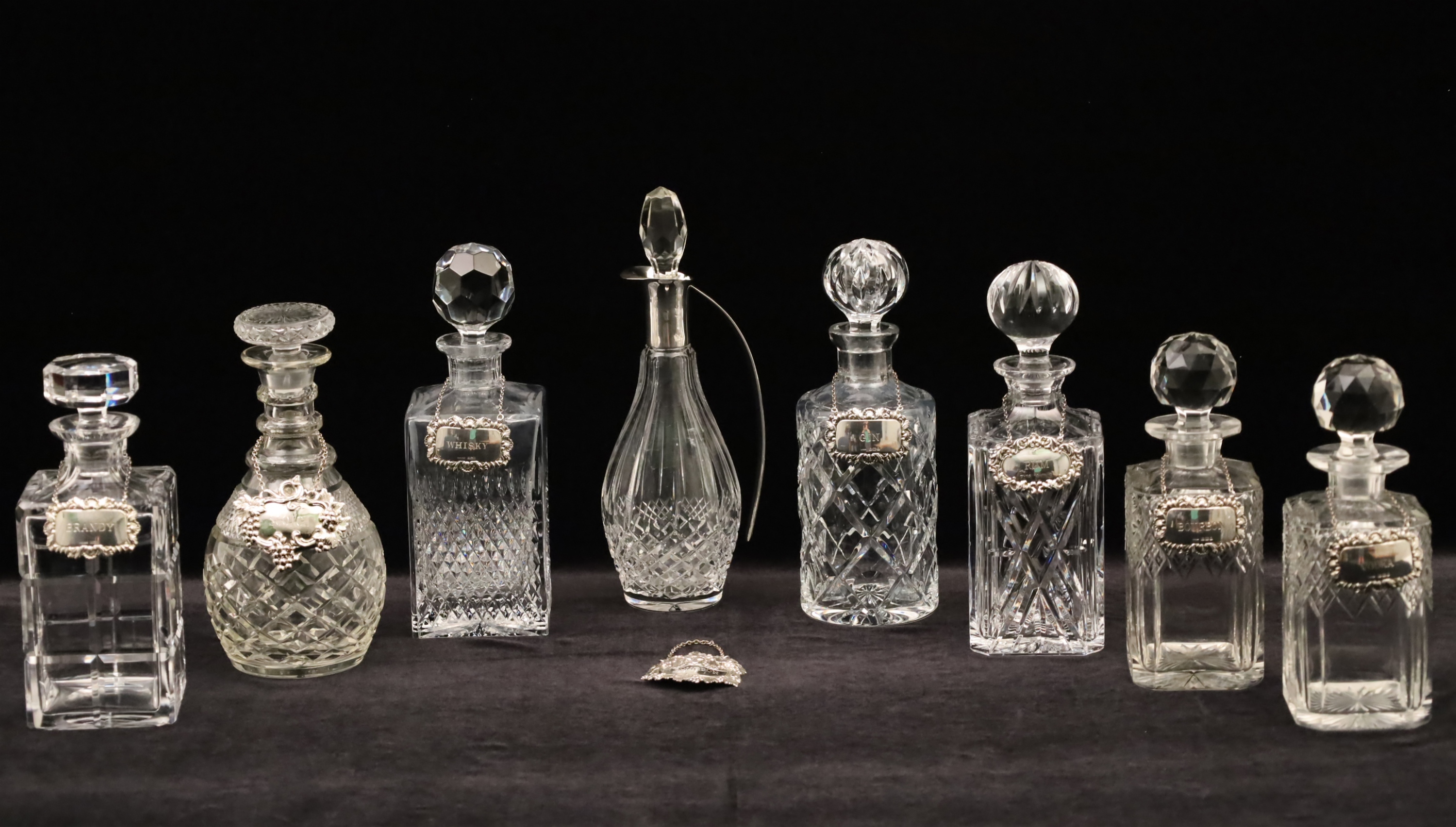 Appraisal: GROUP OF CUT CRYSTAL WHISKY DECANTERS Group of cut crystal