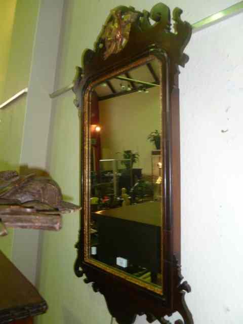 Appraisal: A CHIPPENDALE STYLE MAHOGANY WALL MIRROR of carved and shaped