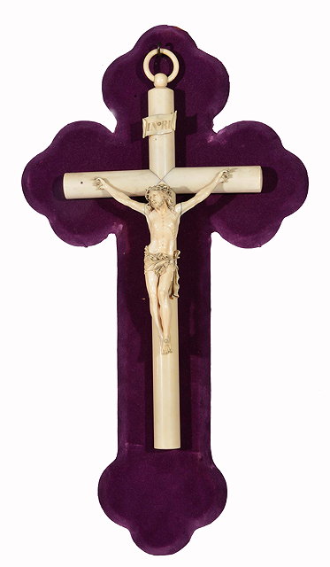 Appraisal: A TH CENTURY IVORY CRUCIFIX mounted on a purpled velvet