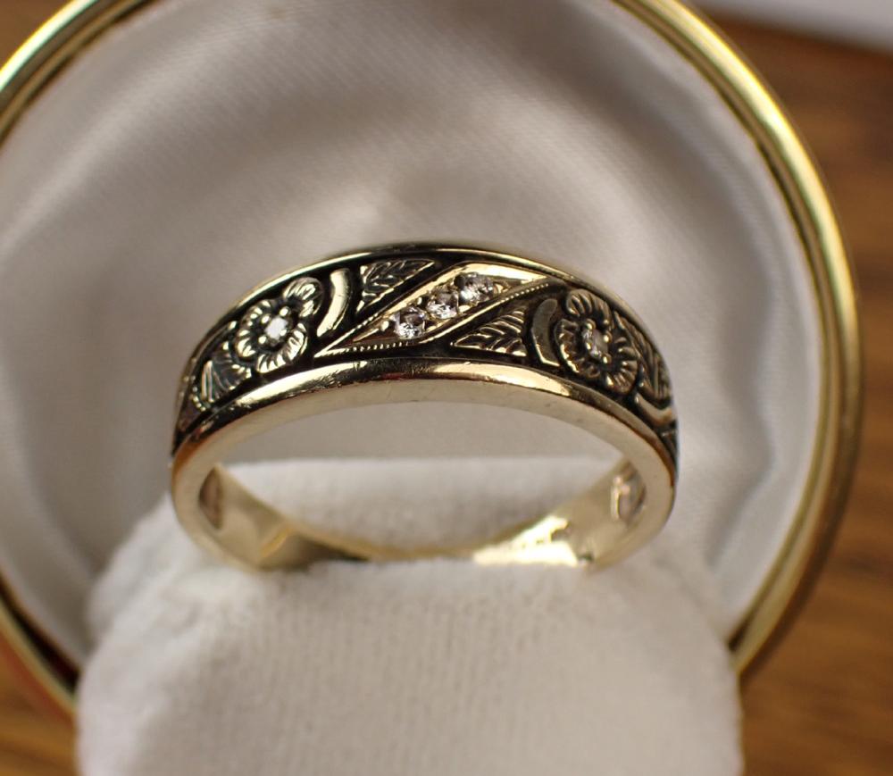 Appraisal: MAN'S DIAMOND AND FOURTEEN KARAT GOLD RING made by Nils