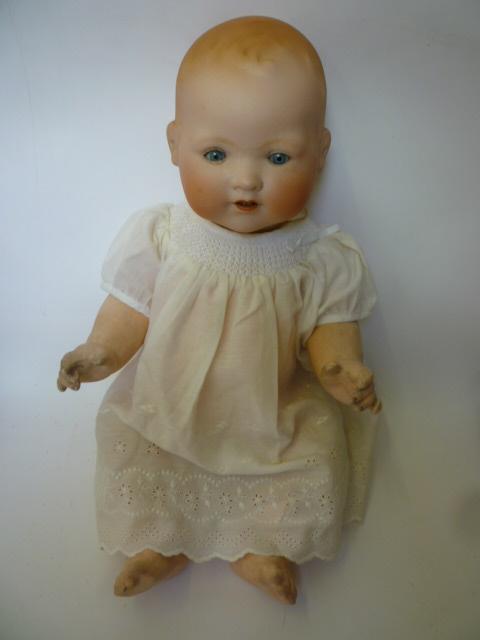 Appraisal: An Armand Marseille bisque head baby doll with pale blue