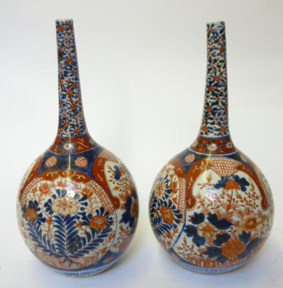 Appraisal: A PAIR OF JAPANESE IMARI PORCELAIN BOTTLE VASES late th