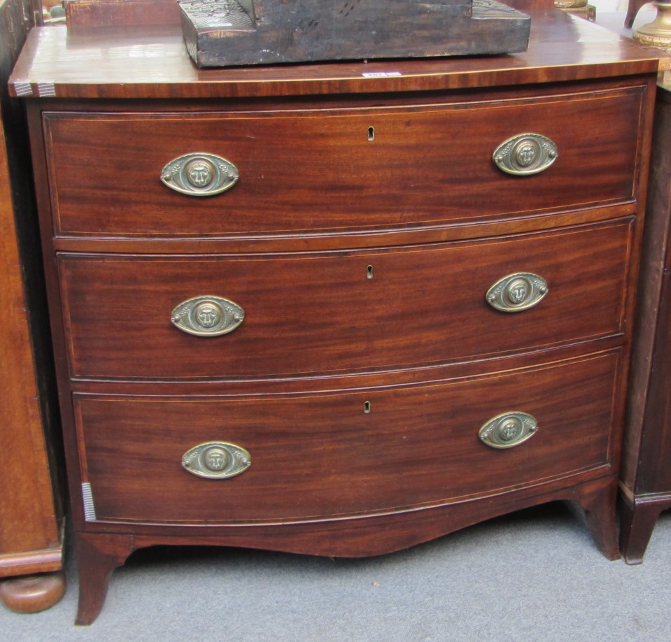 Appraisal: A Regency inlaid bowfront chest of three long graduated drawers