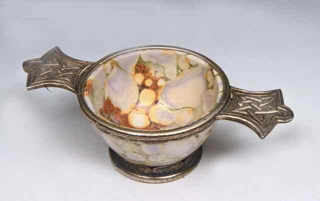 Appraisal: A SCOTTISH QUAICH with porcelain bowl painted like stone with