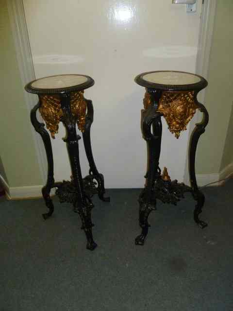 Appraisal: A PAIR OF CAST IRON JARDINIERE STANDS with profuse relief