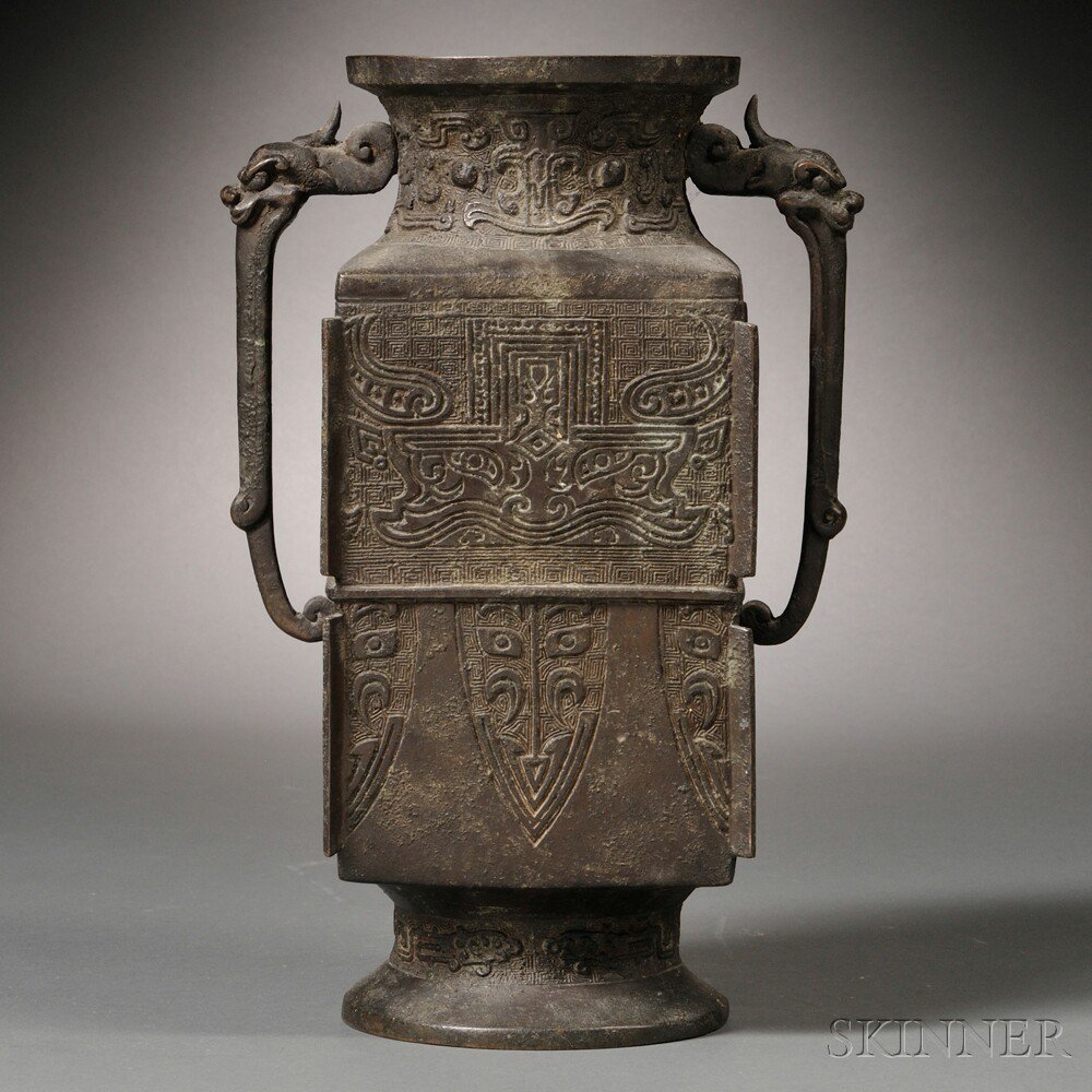 Appraisal: Archaic-style Bronze Vase China the rectangular body cast with taotie