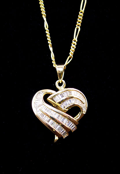 Appraisal: K CTW DIAMOND HEART PENDANT K yellow gold stylized heart