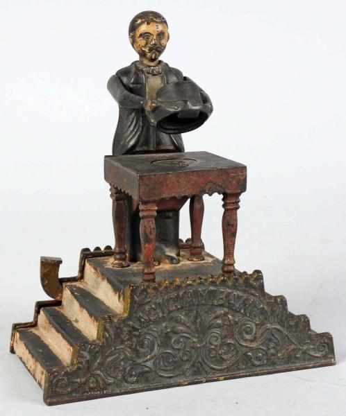 Appraisal: Cast Iron Magician Mechanical Bank Manufactured by J E Stevens