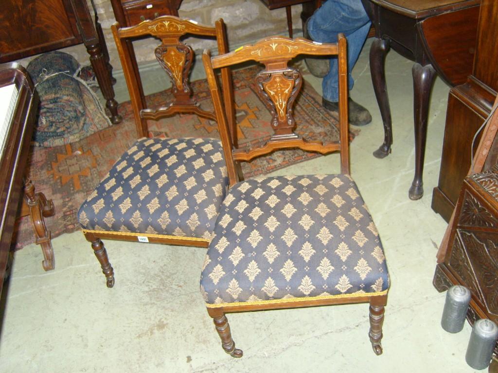 Appraisal: A pair of inlaid Edwardian rosewood drawing room chairs with