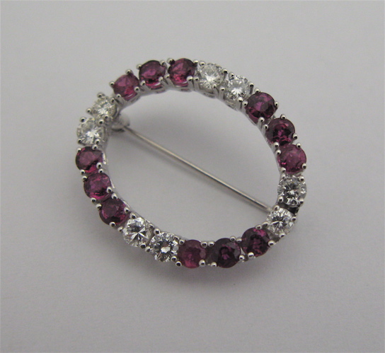 Appraisal: RUBY DIAMOND AND KARAT WHITE GOLD BROOCH set with round-cut