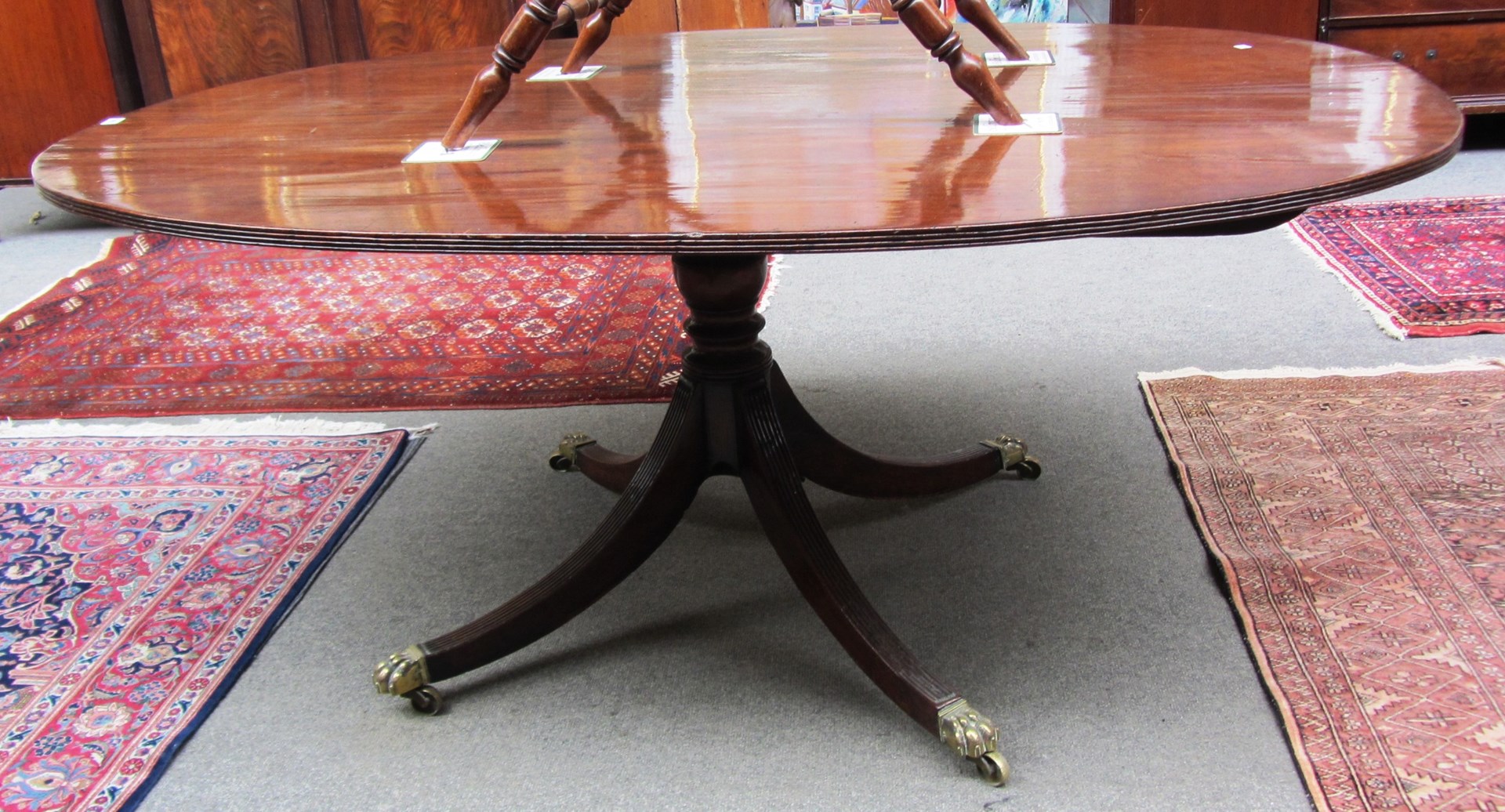 Appraisal: A late George III mahogany snap-top oval breakfast table on