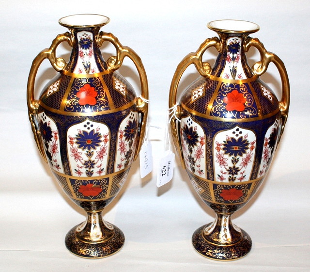 Appraisal: A PAIR OF ROYAL CROWN DERBY STYLE BLUE GROUND BALUSTER