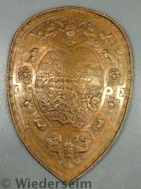 Appraisal: Italian sand-cast bronze shield with raised relief battle scene of