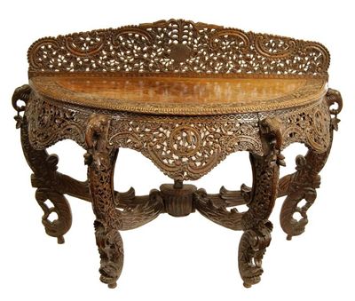 Appraisal: An Anglo-Indian hardwood bowfront console table profusely carved with flowers