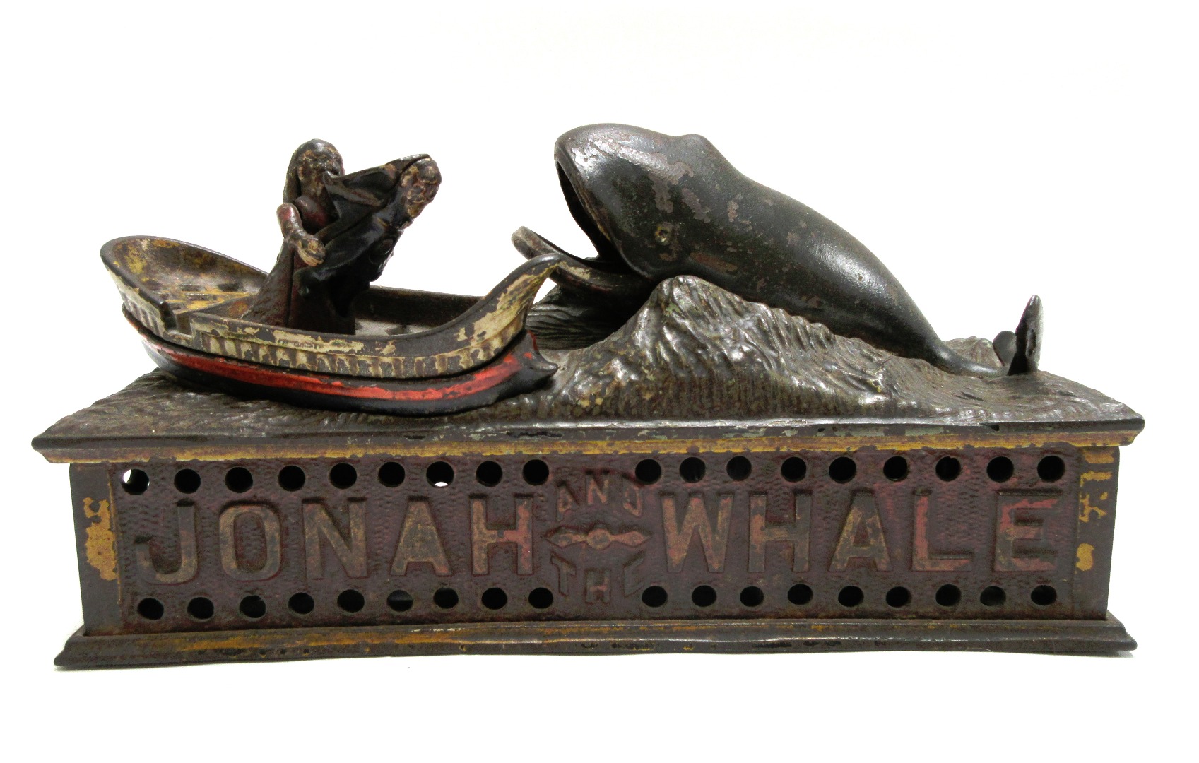 Appraisal: A polychrome painted cast iron 'Jonah and the whale' money