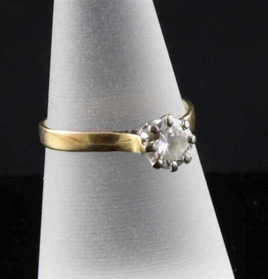 Appraisal: A gold and platinum set solitaire diamond ring the round