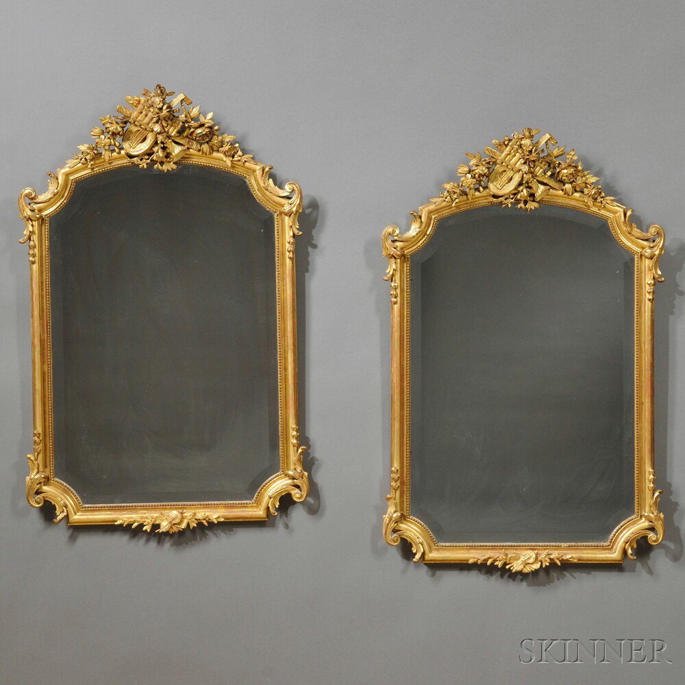 Appraisal: Pair of Louis XVI-style Carved and Gilded Pier Mirrors late