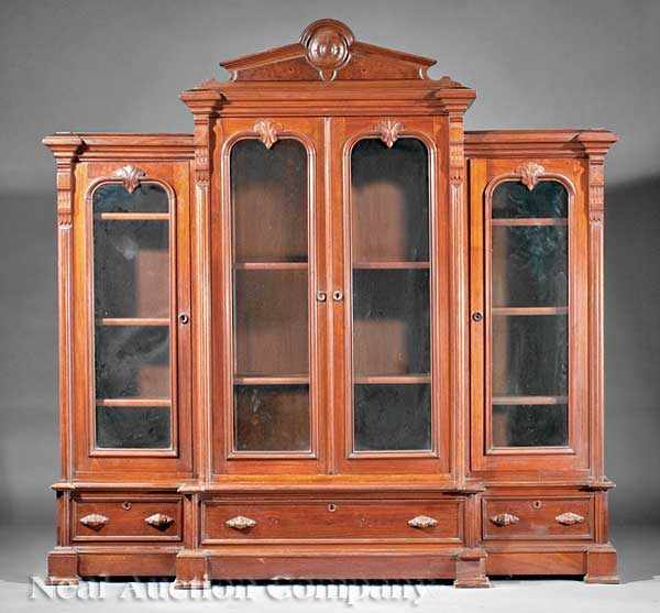 Appraisal: An American Renaissance Carved Walnut Bookcase th c pedimented cornice