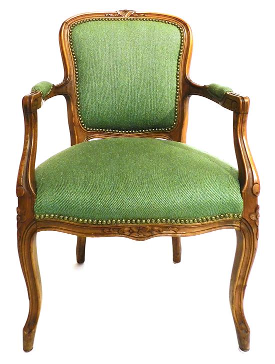 Appraisal: French style open armchair floral carved fruitwood frame green tweed