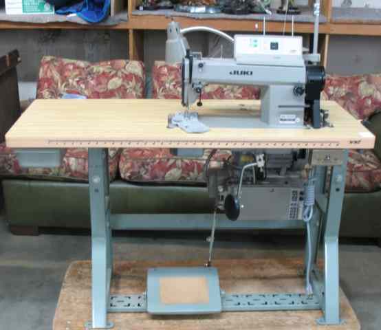 Appraisal: JUKI INDUSTRIAL SEWING MACHINE AND WORK TABLE sewing machine model