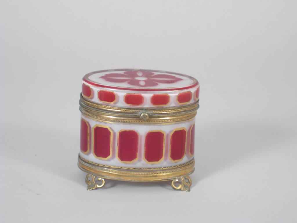 Appraisal: A Milk Glass oval Box with brass mounted and hinged