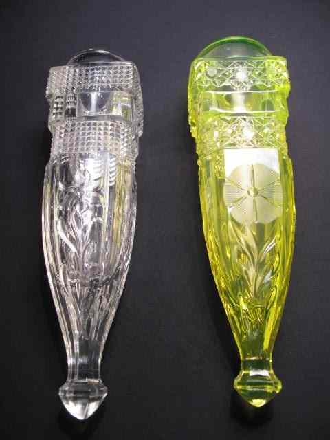 Appraisal: Two vintage glass automobile bud vases The first Vaseline glass