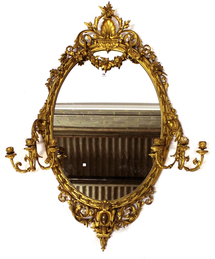 Appraisal: A Victorian gilt framed oval wall mirror with shell crest