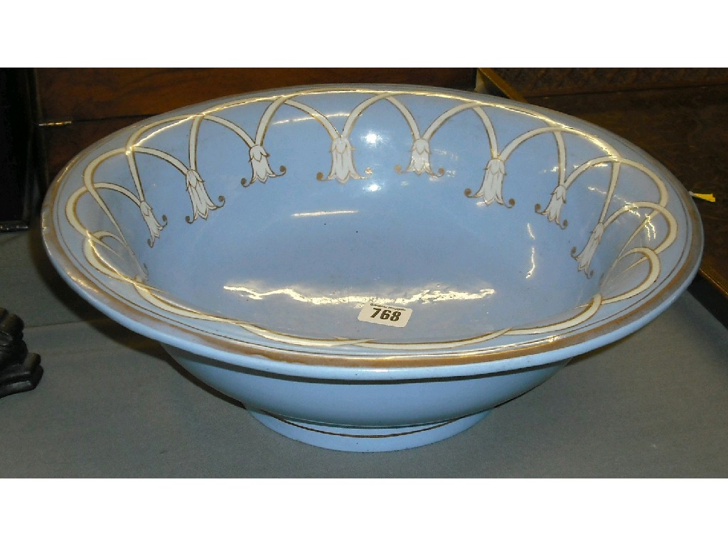 Appraisal: Stone China wash bowl with foliate designs and gilt highlights